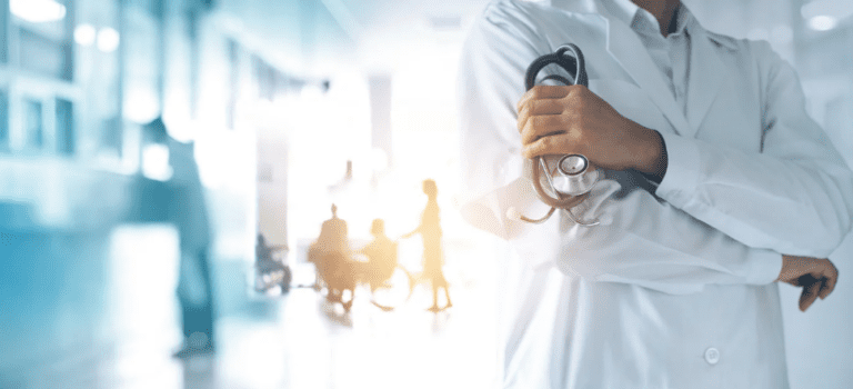Healthcare technology solutions header image with a doctor holding a stethoscope