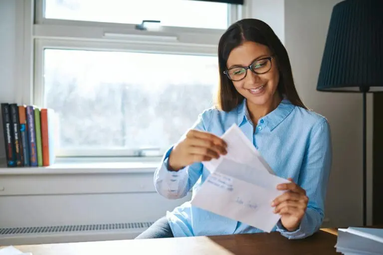 Young business entrepreneur checking her mail