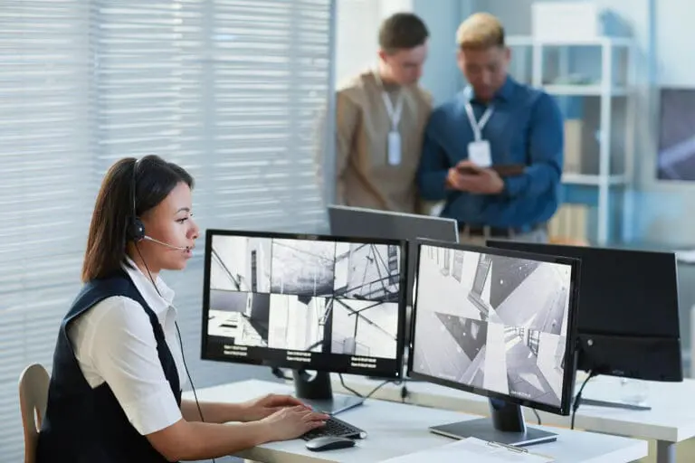Female security guard watching CCTV security cameras