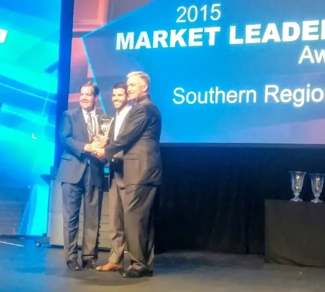 Shane Berry and Brian Berry receiving the 2015 Toshiba Southern Region Dealer of the Year award.