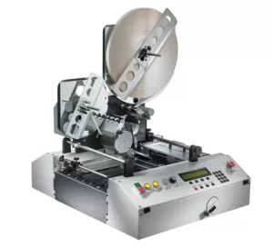 Image of a Quadient TA-30 mail tabber. The machine, renowned for its high-speed operation and ability to apply tabs, stamps, and labels, is presented in a clear and detailed view. Its design and advanced features reflect its role as a versatile alternative to envelopes, simplifying and speeding up mail processing tasks.