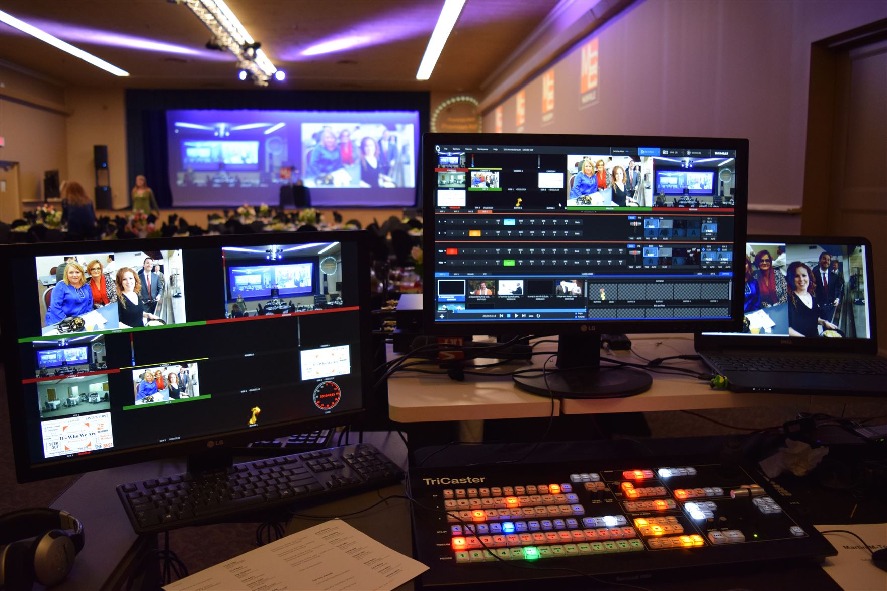 Image displaying multiple computer screens in the foreground, each showing various aspects of the NewTek Tricaster video production system. The screens reveal intricate details of the software's interface, demonstrating its complex functionality and capabilities in managing real-time video production.