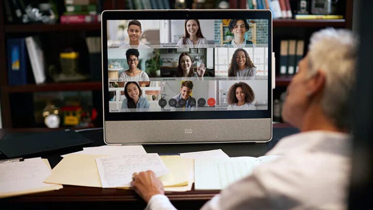 Teacher using Webex video meetings to teach a class of students virtually.