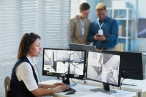 Female security guard watching CCTV security cameras