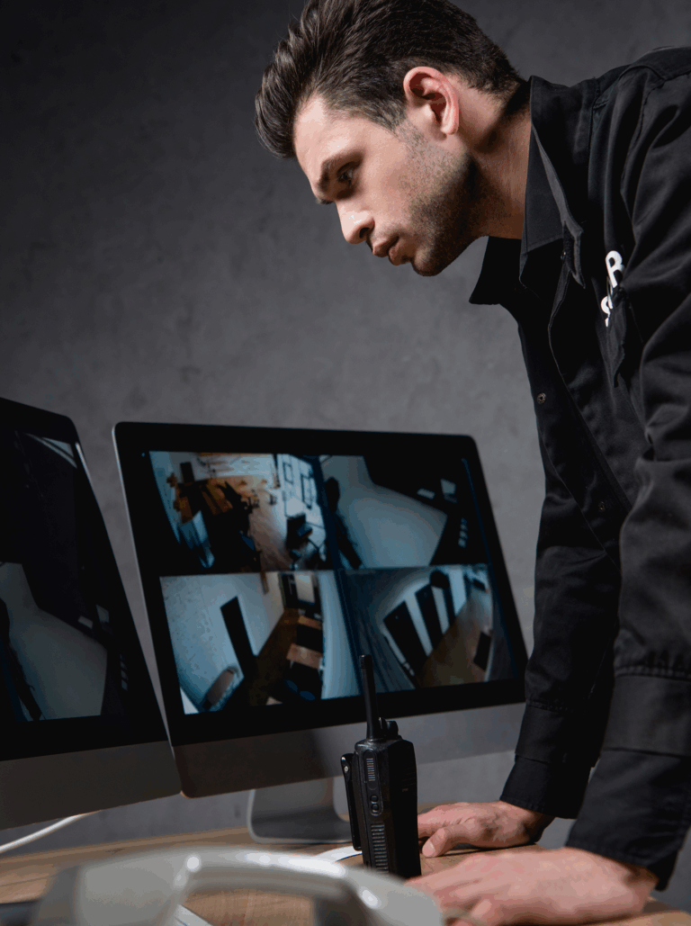 security guard watching cctv monitors