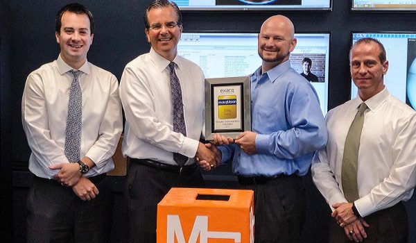About MCC - Awards - Security Solutions salespeople accepting an award from Chris Throckmorton of exacvision