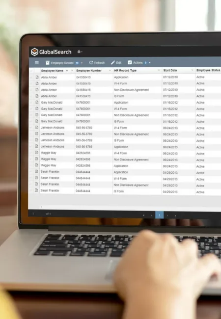 Professional woman confidently navigating the Square 9 document management software (DMS) on her computer. This image exemplifies the ease-of-use and practical benefits of integrating such robust document management systems into your business operations. See firsthand how our workflow automation can streamline tasks and boost efficiency in your daily routines.