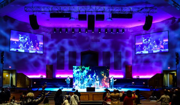 Image of the Breath of Life Church stage featuring audio visual lighting and sound systems by MCC.