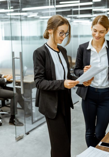 Business people near the copier in the hallway