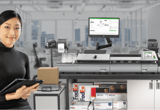 woman standing in front of the Quadient iX-9 Smart mailing system