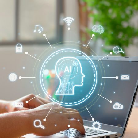 Vertical Image on Using of a laptop to interact with an artificial intelligence.
