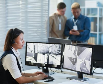Female security guard watching CCTV security cameras