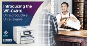 Introducing the Epson WF-C4810 printer image with man behind shop counter putting customer purchase in bag