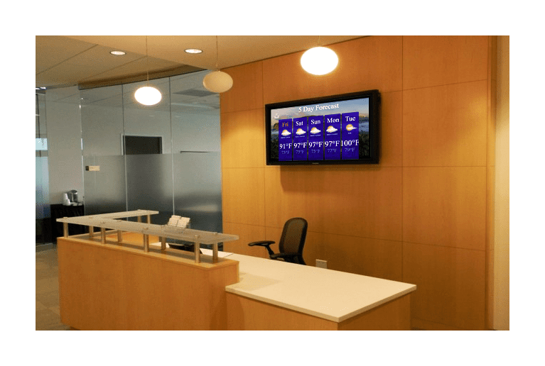 Works on any size commercial TV MCC Media digital signage behind reception desk